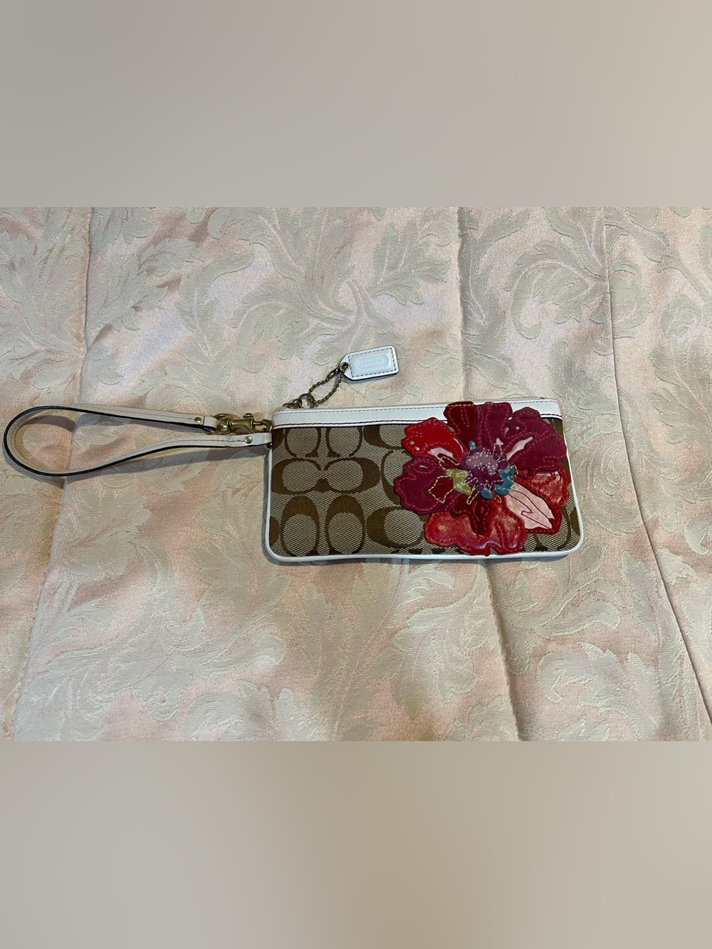 Coach Brown Signature Canvas Wristlet with Red Floral Applique